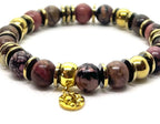 Bracelet rhodochrosite 8 mm porté au poignet