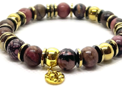 Bracelet rhodochrosite 8 mm porté au poignet